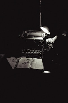A black and white photo of an old typewriter