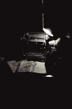 A black and white photo of an old typewriter