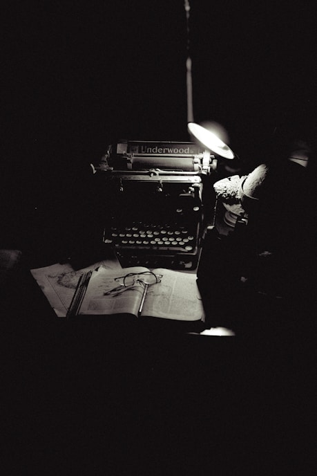 A black and white photo of an old typewriter