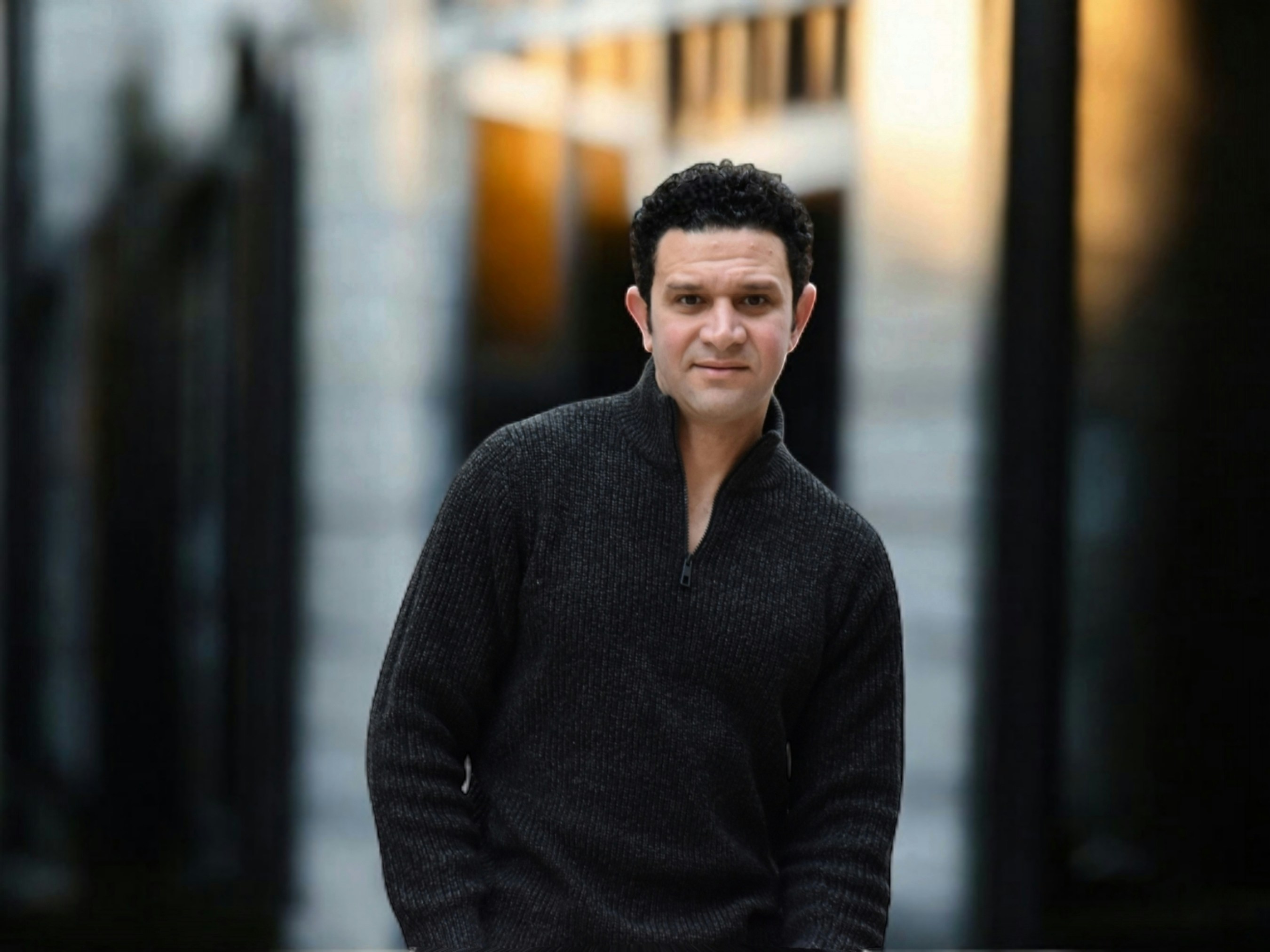 A man standing in front of a building