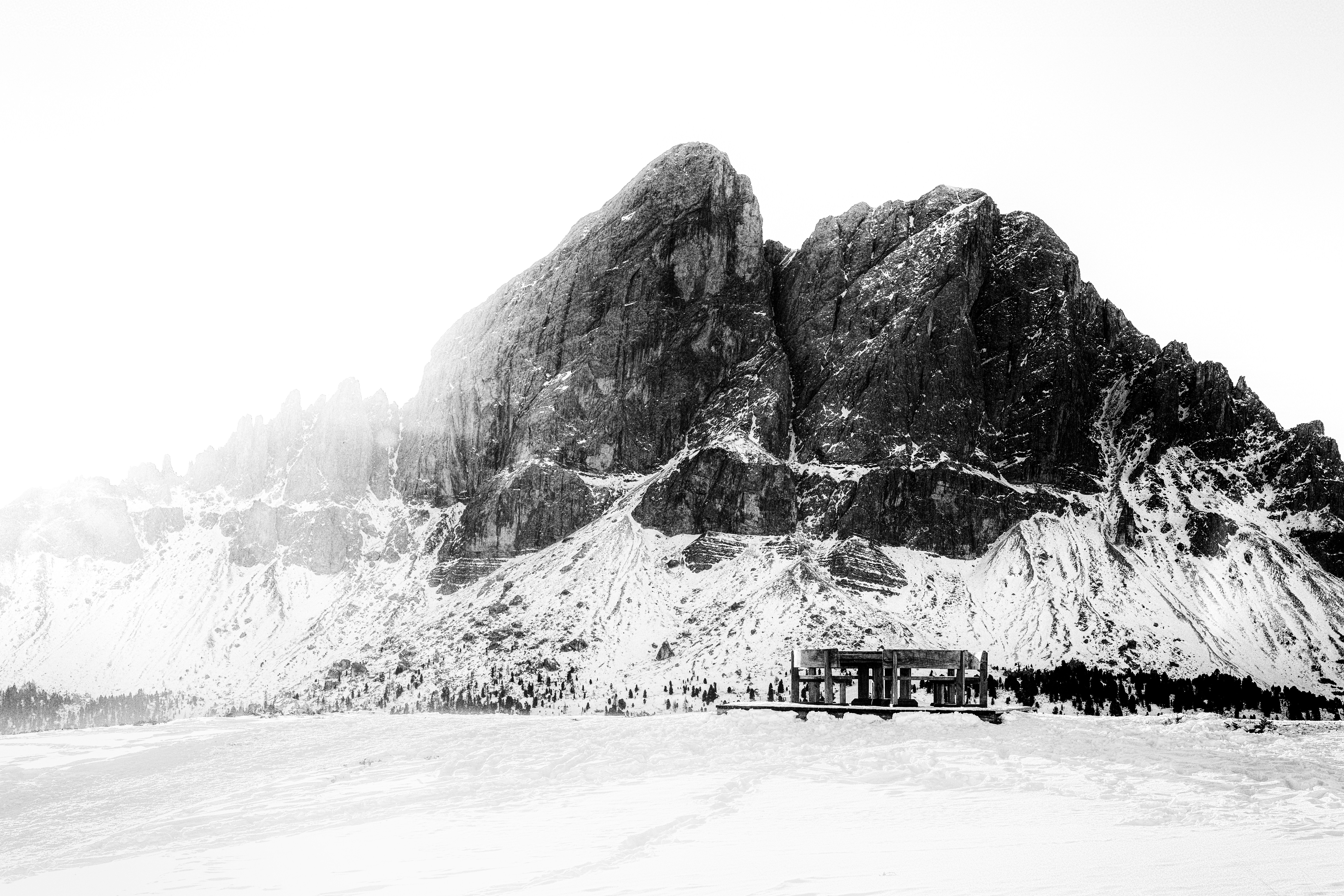 A black and white photo of a snow covered mountain