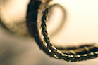 A close up of two rings on a white surface
