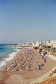 A beach with a bunch of umbrellas on it