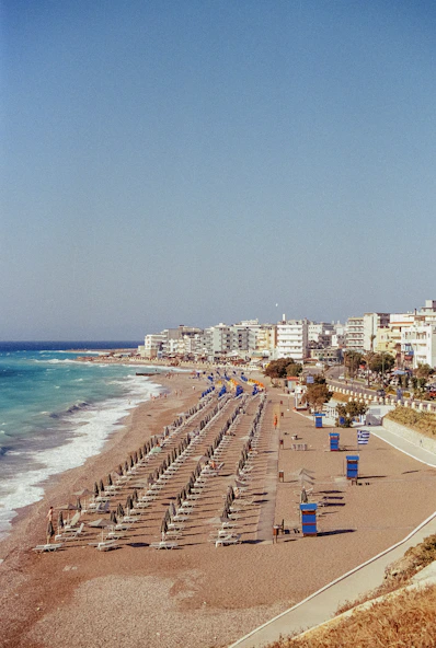 A beach with a bunch of umbrellas on it