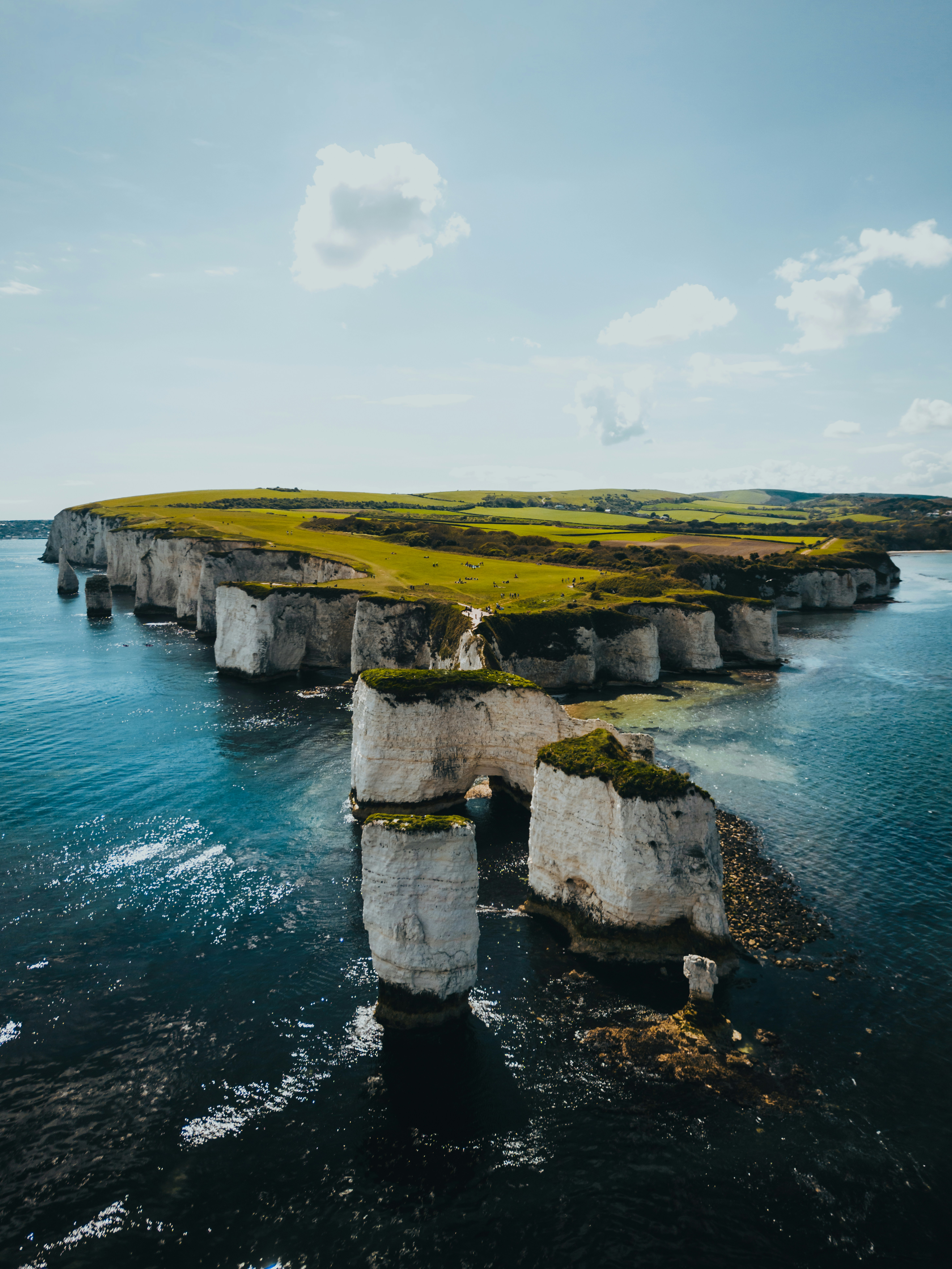 A large body of water surrounded by cliffs