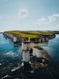 A large body of water surrounded by cliffs