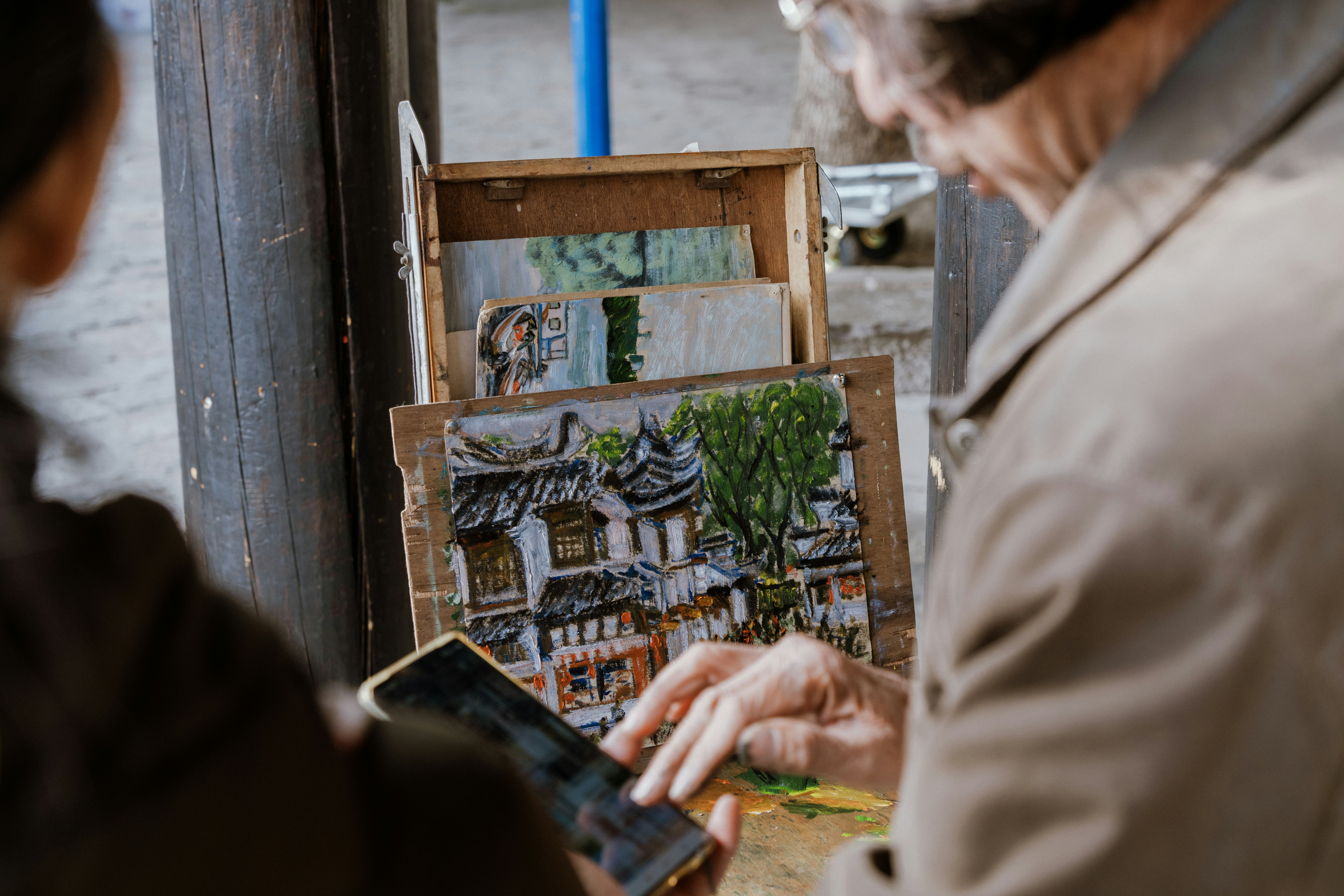 A man and a woman looking at a picture