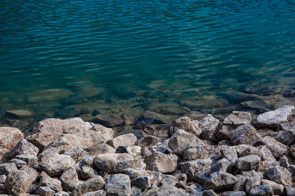 Boat on a lake surrounded by rocks
