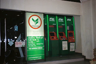A row of green and red vending machines