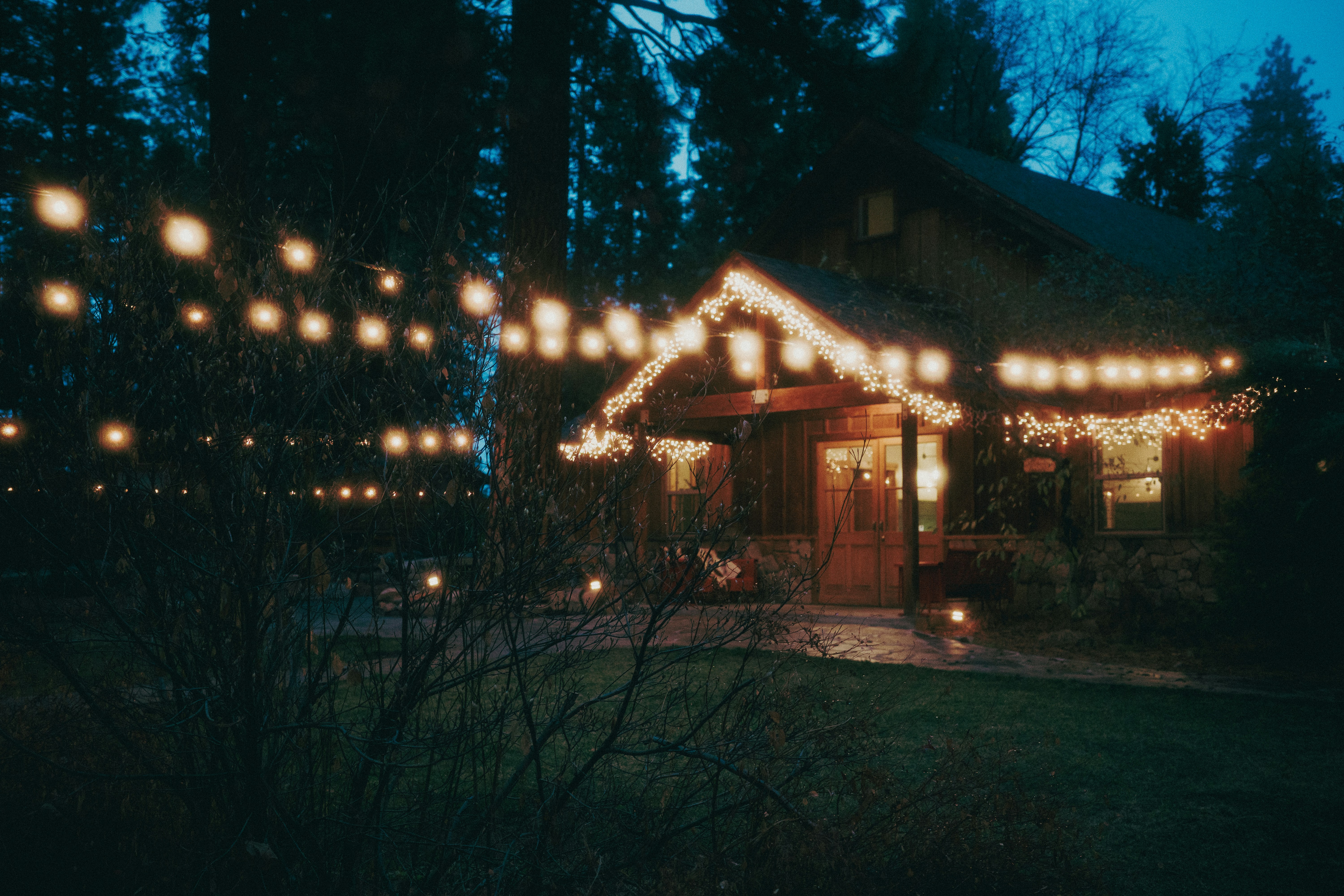A house covered in christmas lights at night