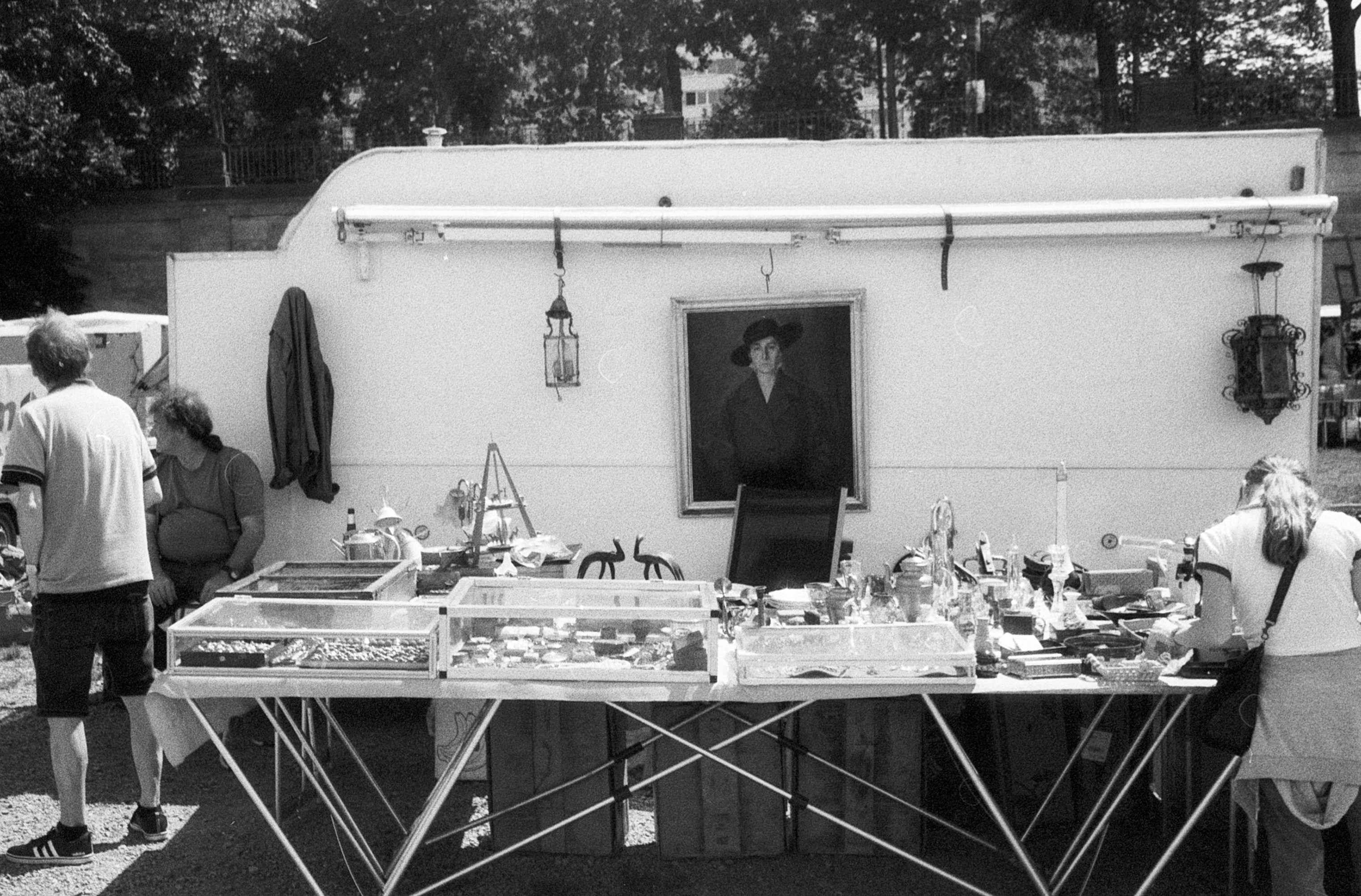 A group of people standing around a table