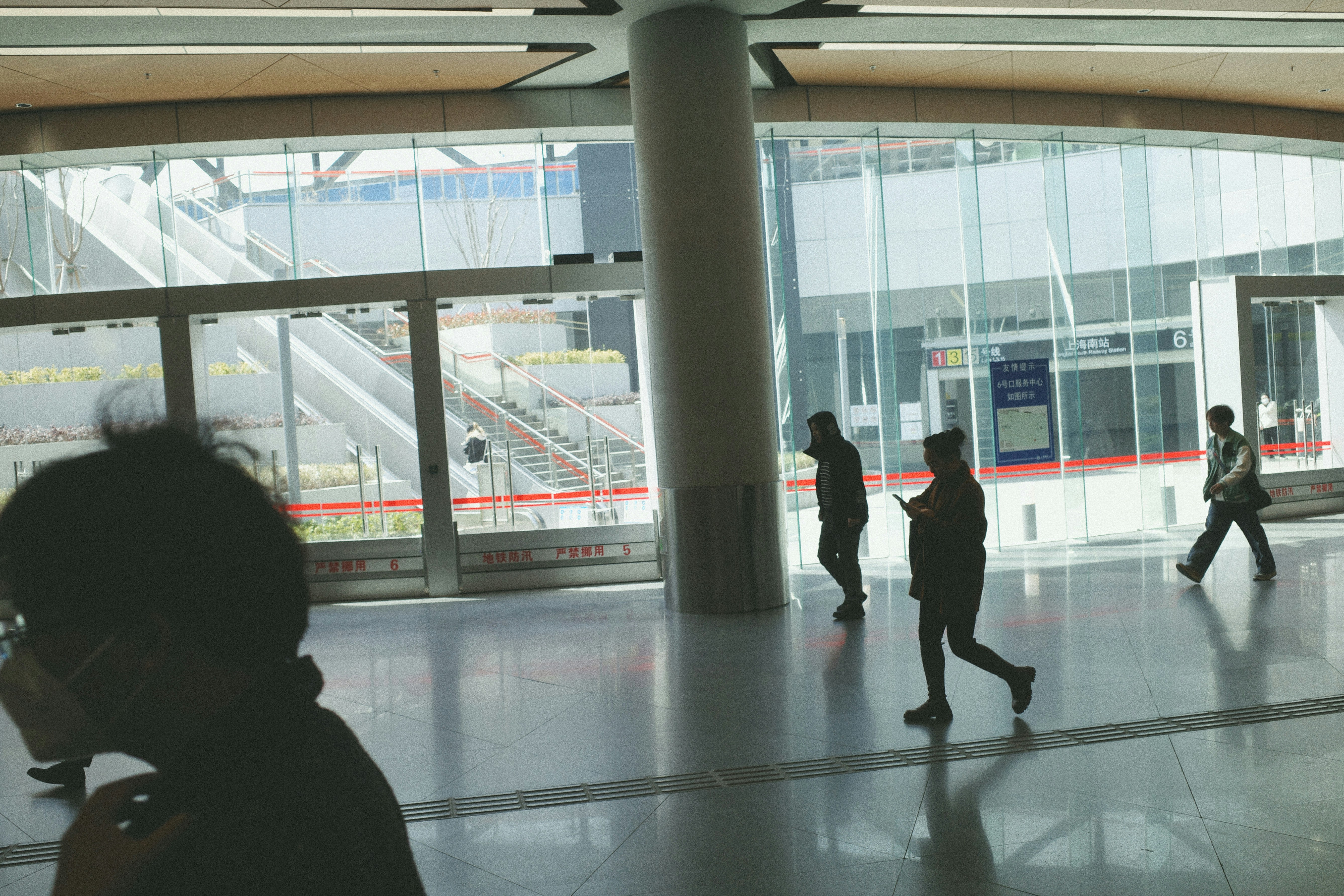 traveler confidently walking through a modern airport, not drawing attention - how to travel discreetly