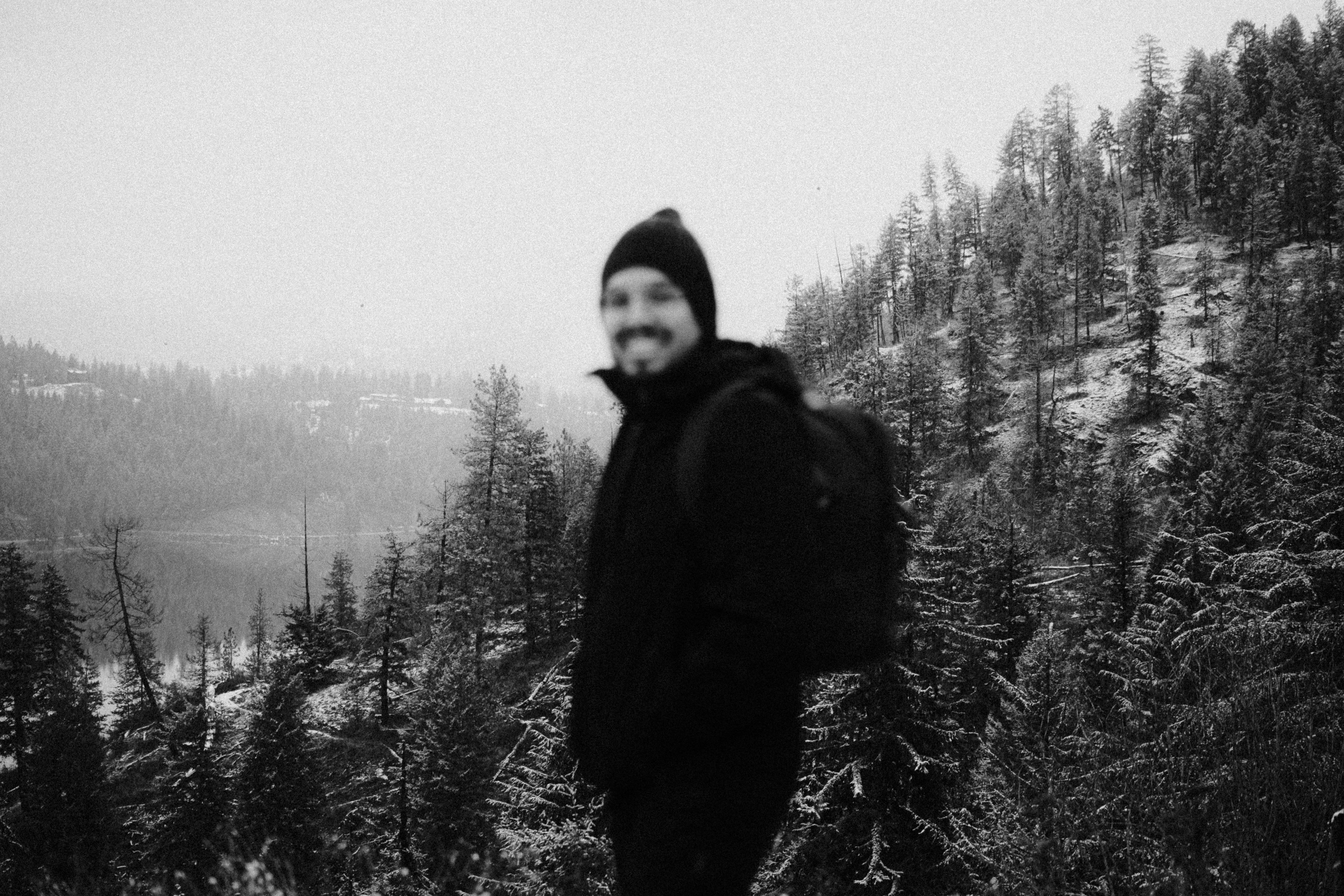 A man standing on top of a snow covered slope