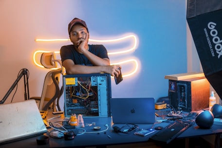 A man sitting in front of a laptop computer