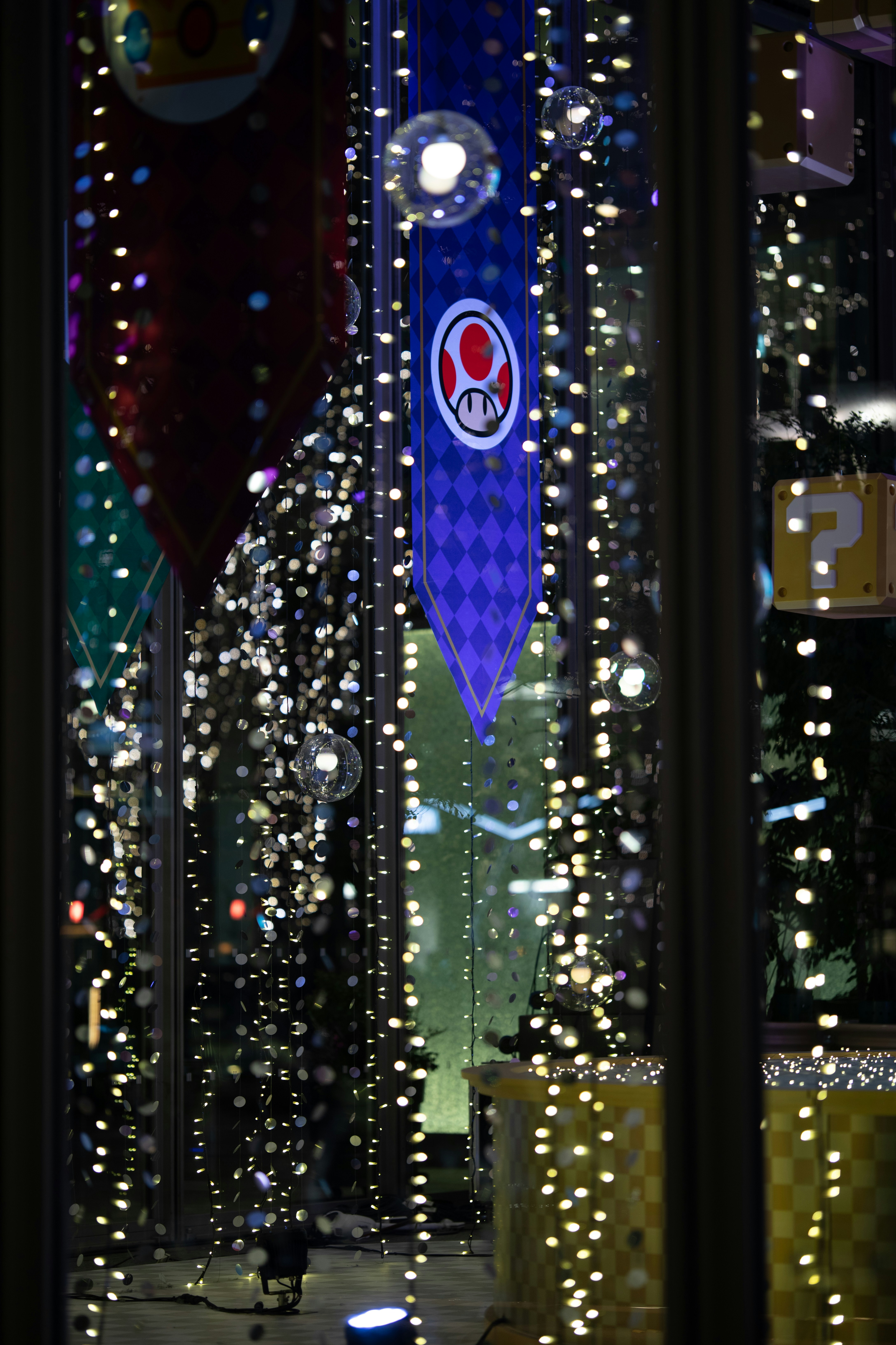 A view of a building through a window at night