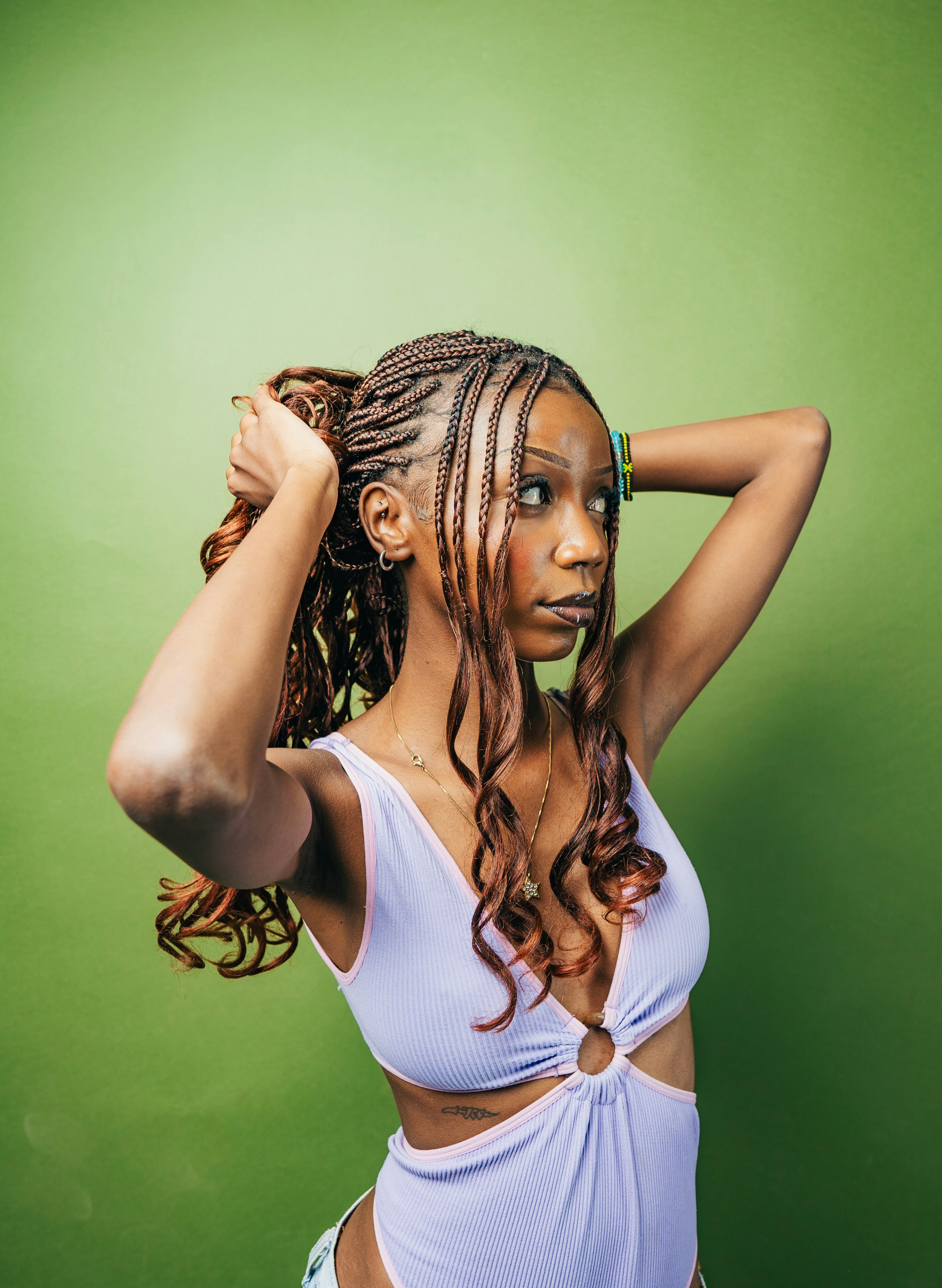 A woman in a white bathing suit posing for a picture