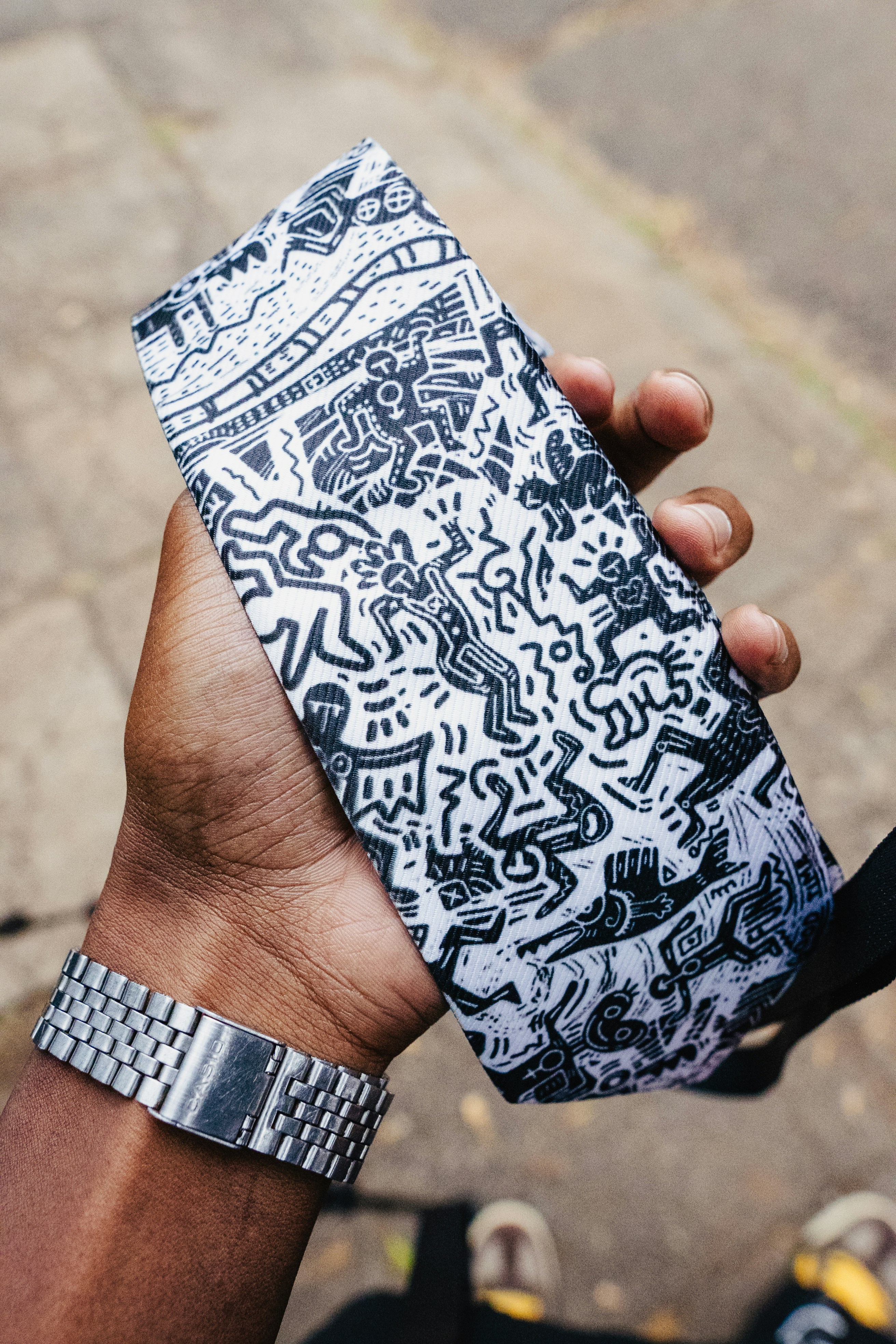 A person holding a cell phone in their hand