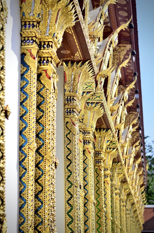 A row of gold and blue ornate designs on a building