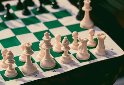 A close up of a chess board with pieces on it