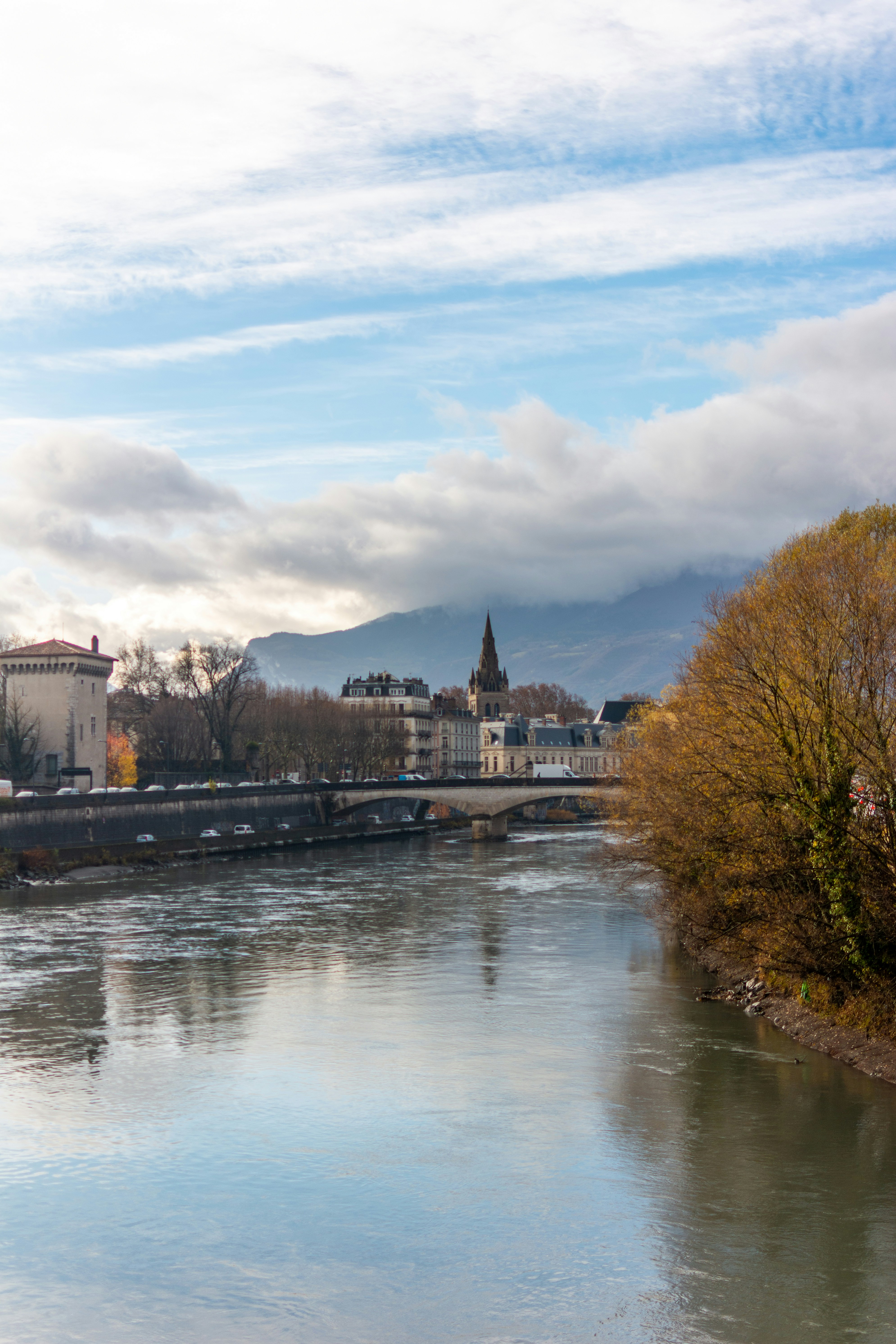 A river running through a city next to tall buildings