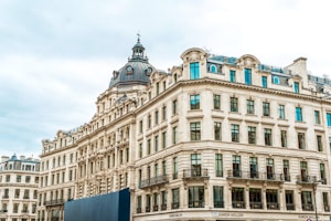 A large building with many windows in a city