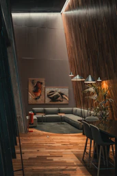 A living room filled with furniture and a wooden floor