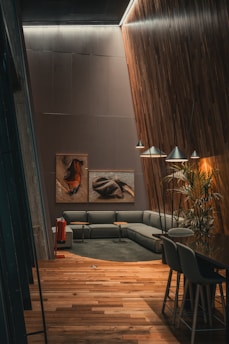 A living room filled with furniture and a wooden floor