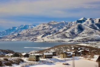 A view of a mountain range with a lake in the foreground