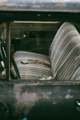 A truck with a bunch of seats inside of it