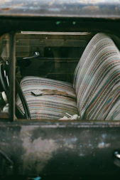A truck with a bunch of seats inside of it