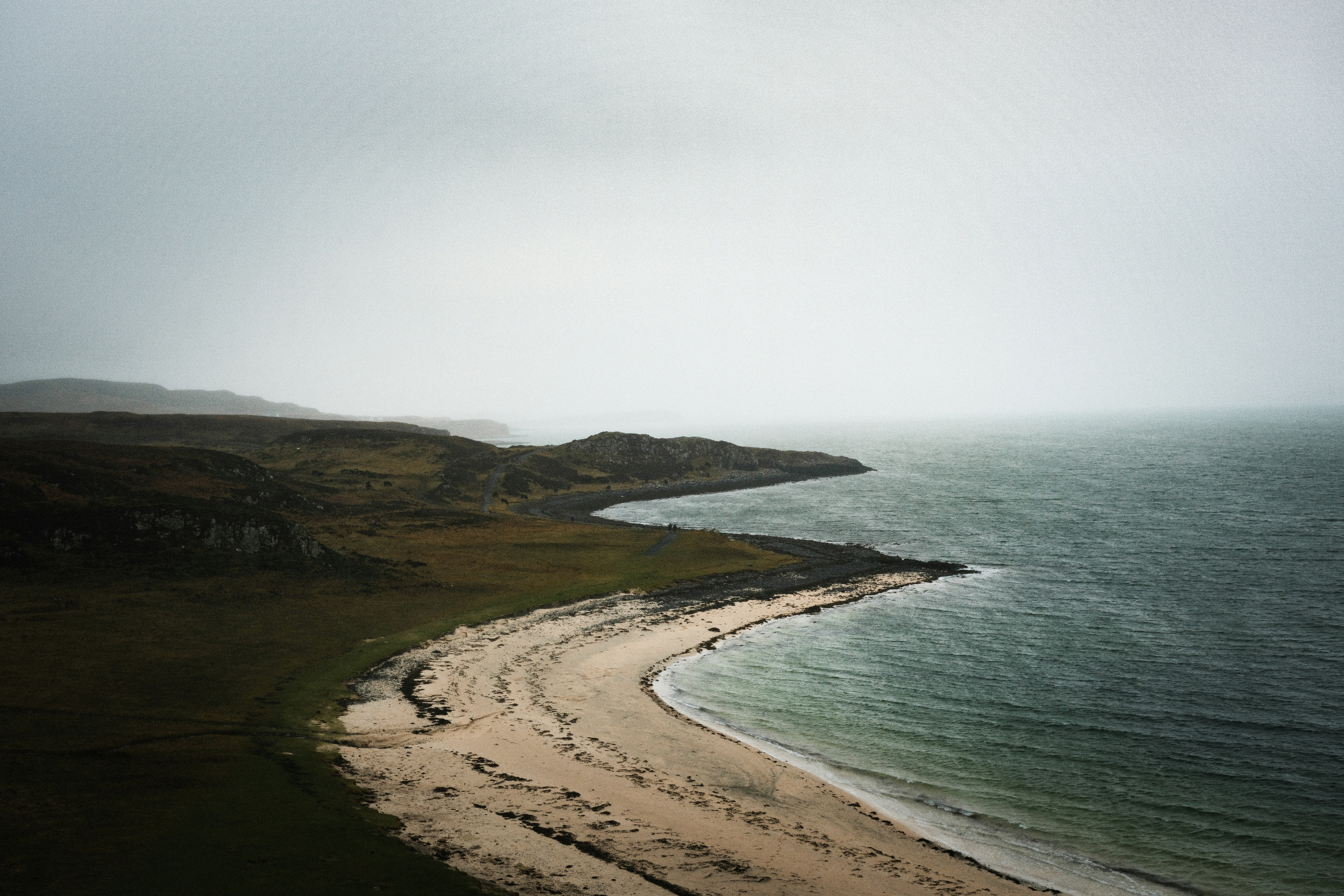An aerial view of a beach and a body of water