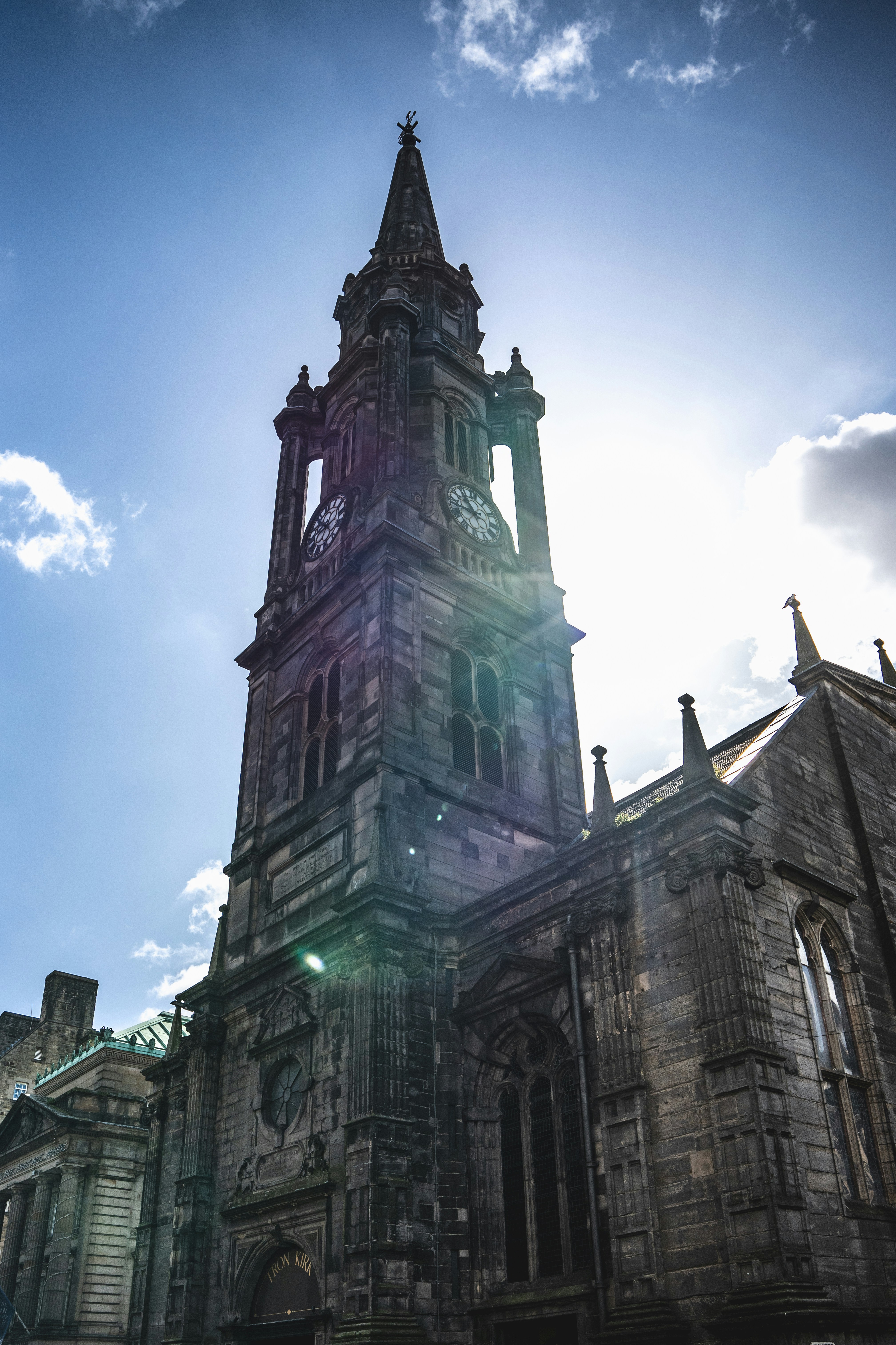 A very tall building with a clock on it's side