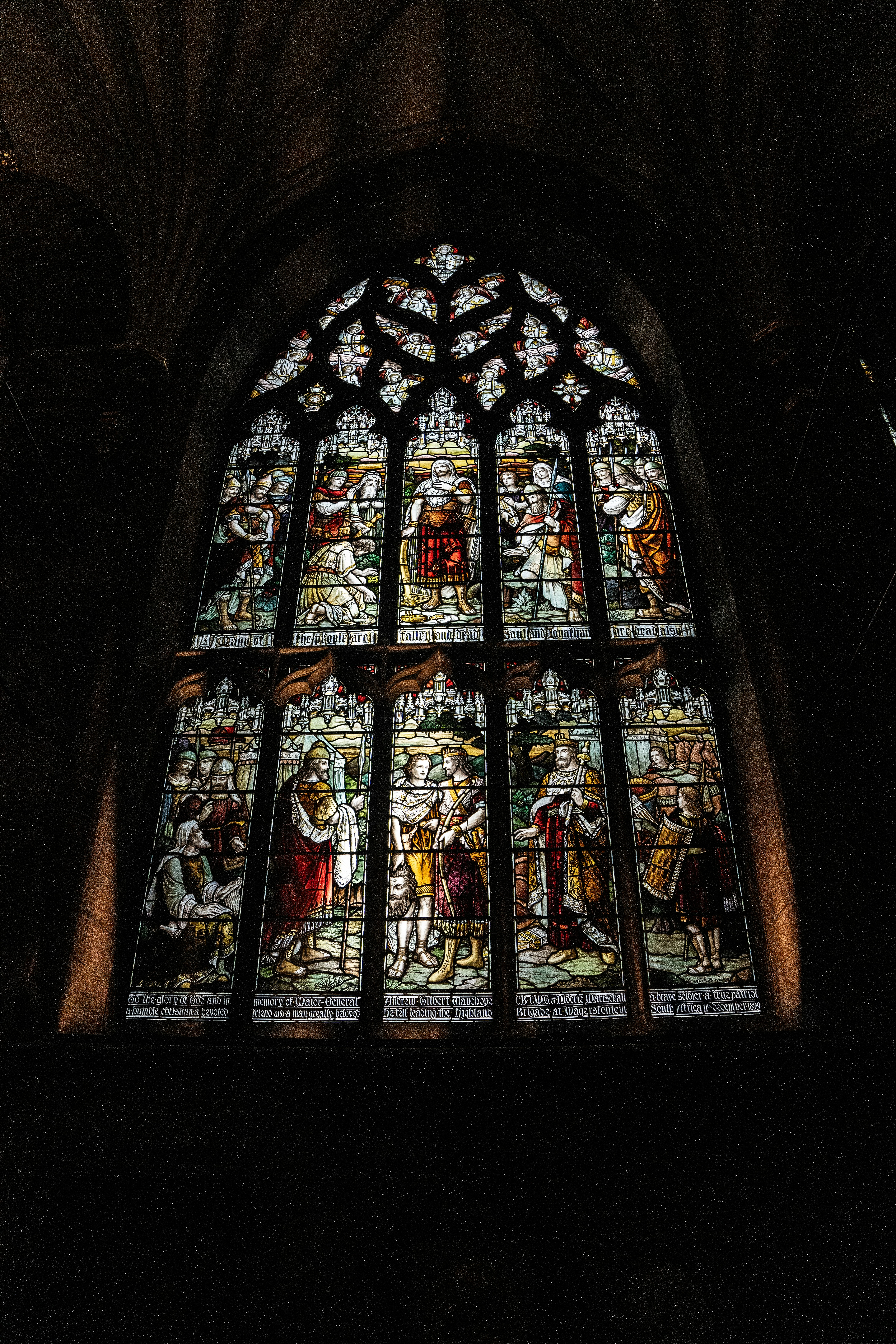 A large stained glass window inside of a building