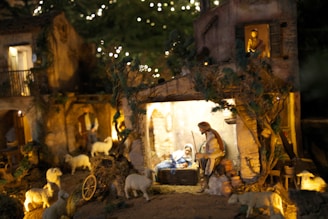 A nativity scene with a man and a baby in a manger scene