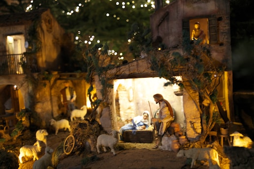 A nativity scene with a man and a baby in a manger scene