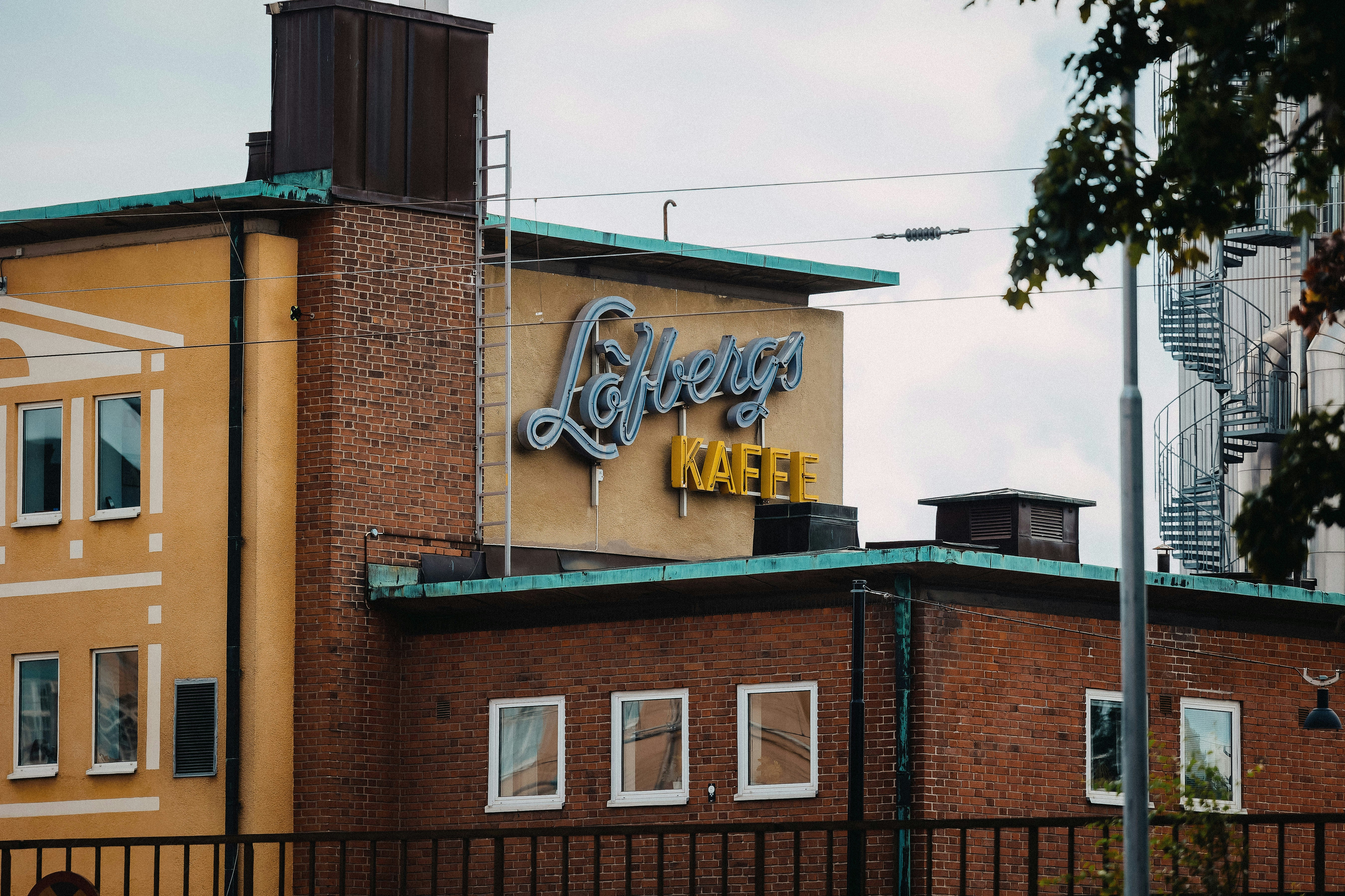 A building with a sign on the top of it