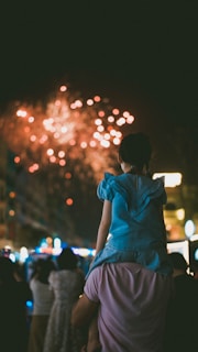 A group of people watching a fireworks display