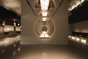 A dimly lit room with a circular light fixture