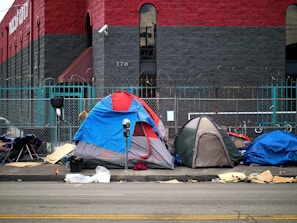 A group of tents sitting on the side of a road