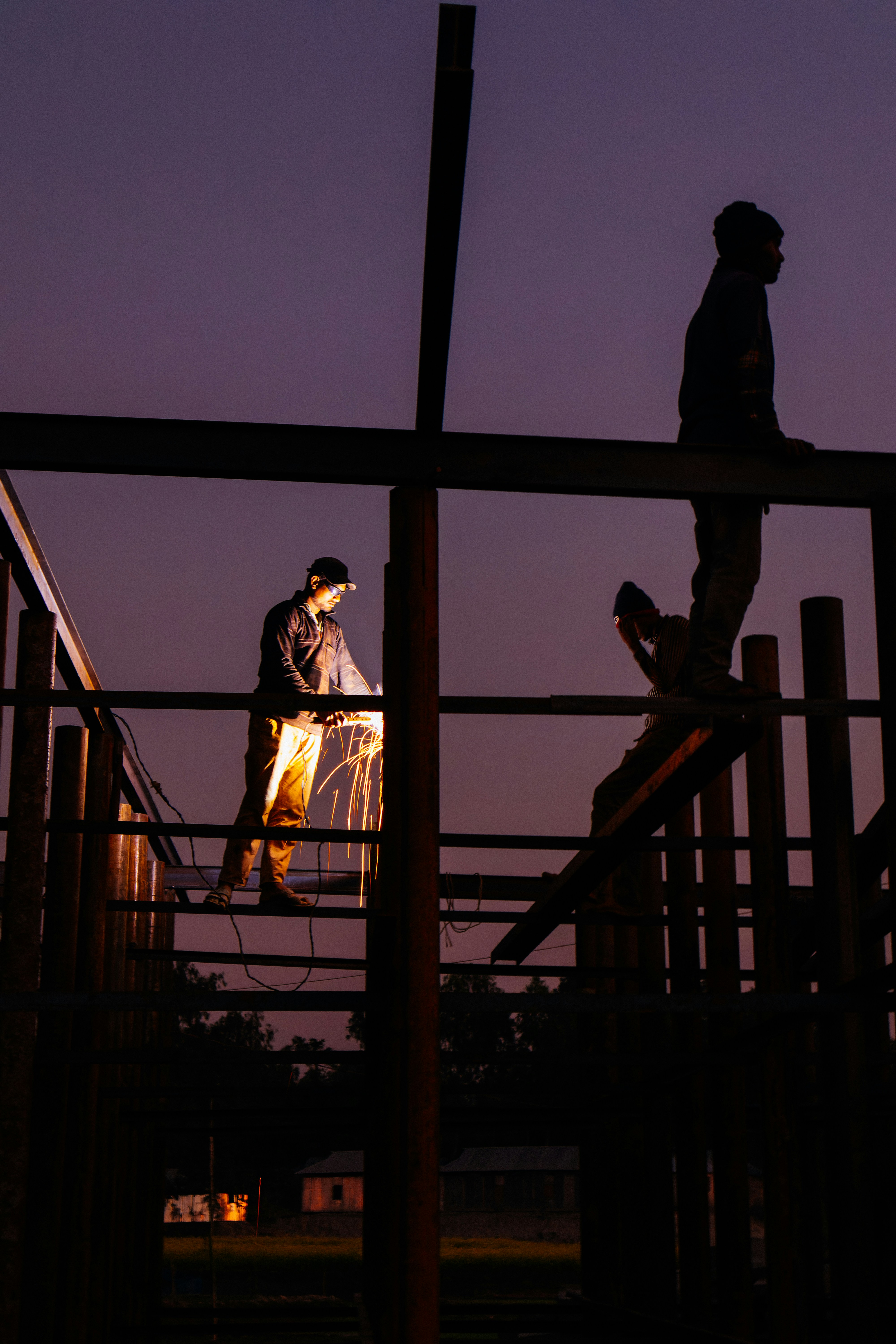 A couple of people standing on top of a wooden structure