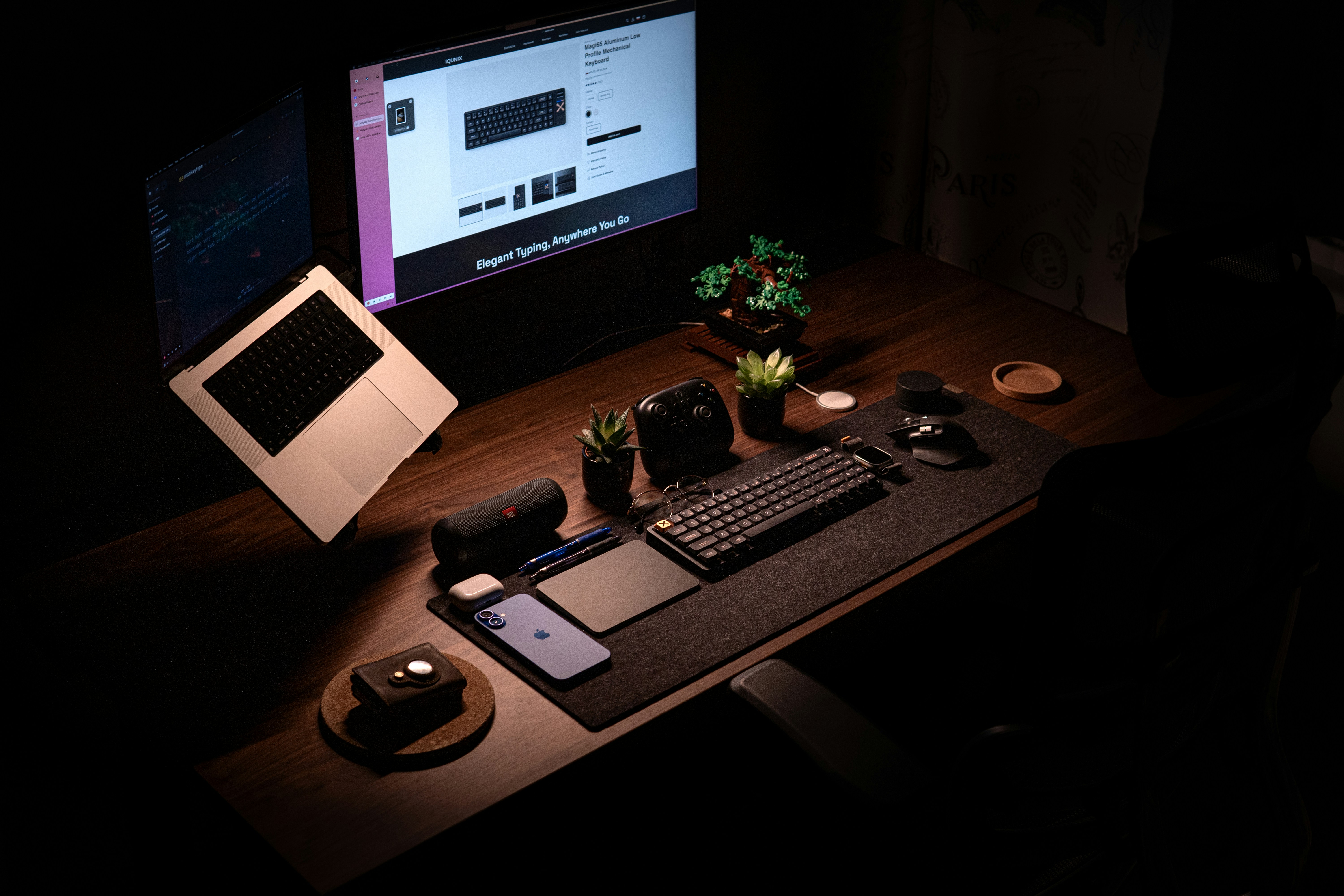 A desk with a computer and a laptop on it