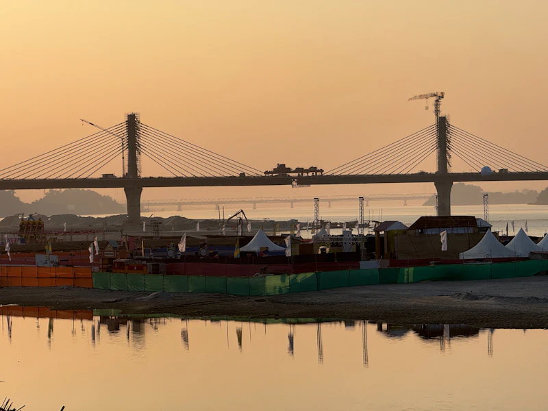 Sunset over the Brahmaputra at Guwahati, a bridge across the river in the haze