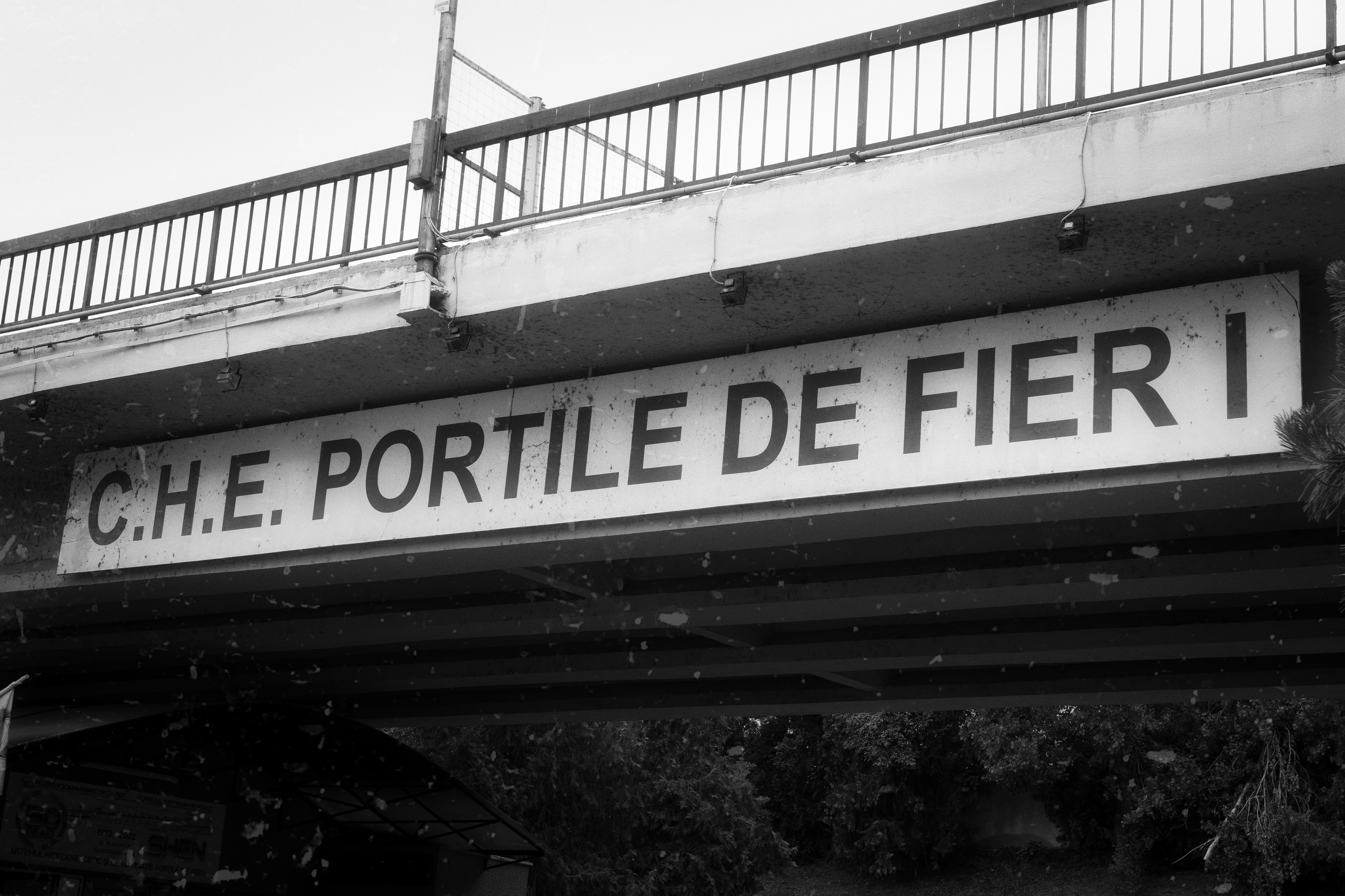 A black and white photo of a street sign