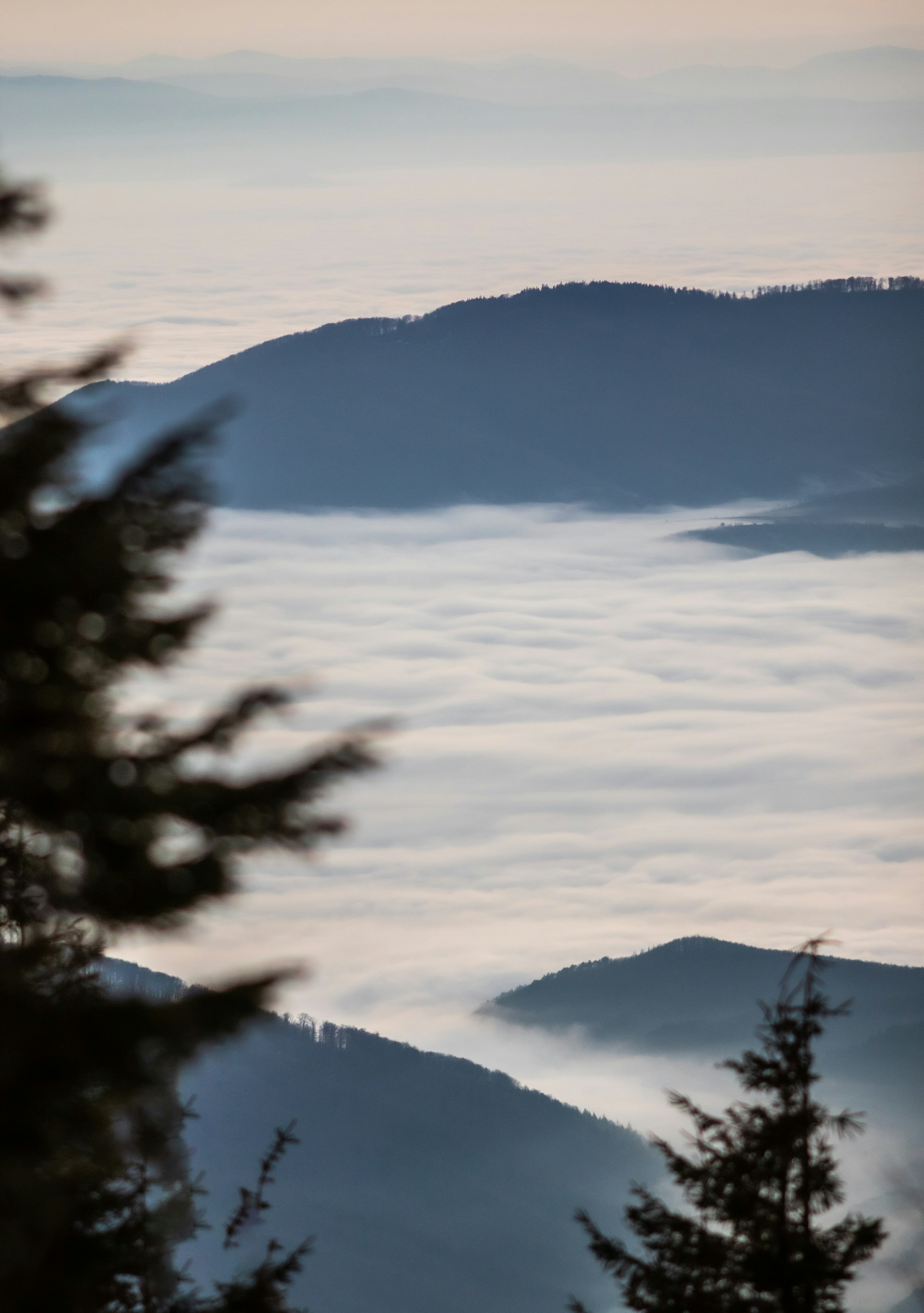 A view of the mountains and clouds from a distance