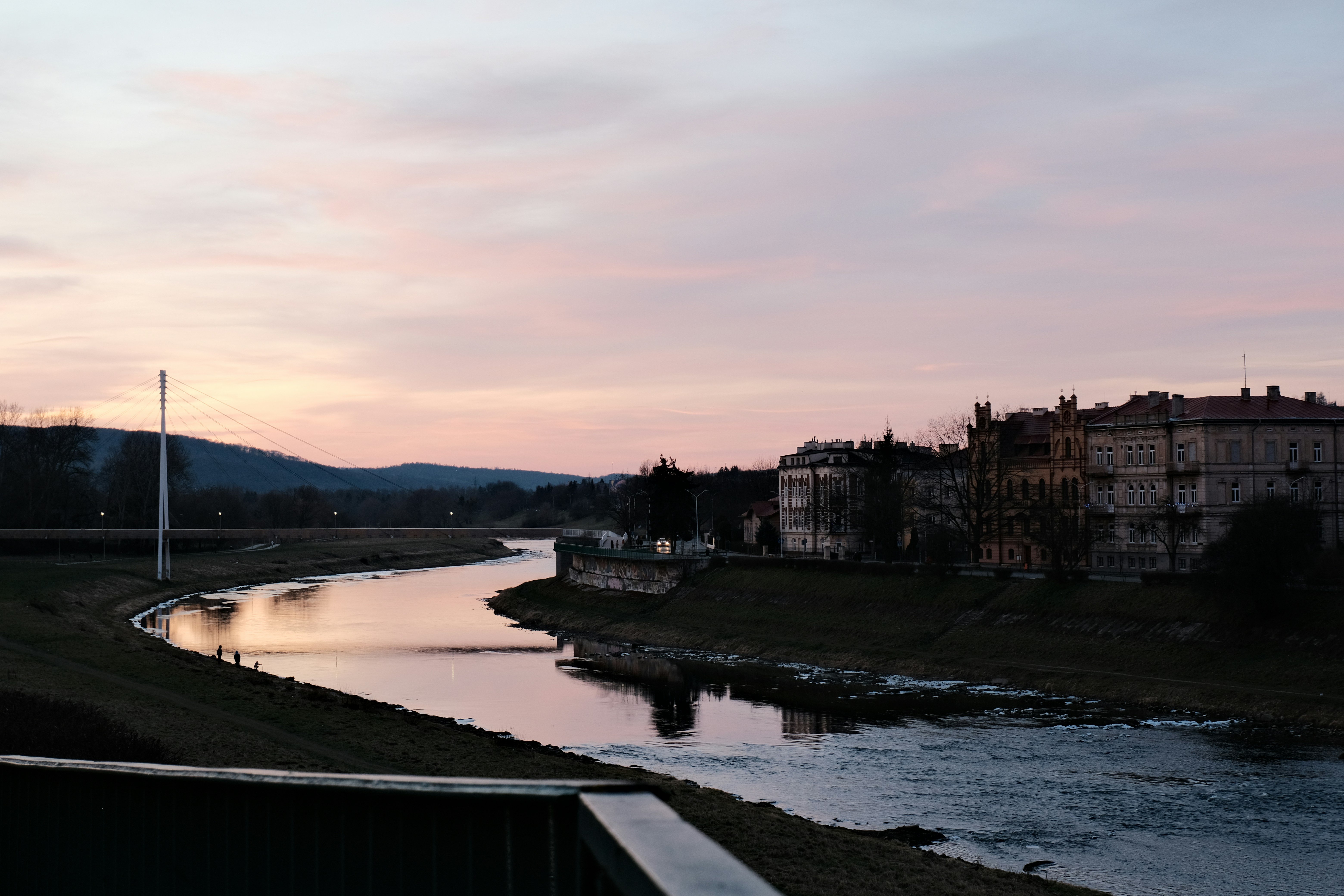 A river running through a lush green countryside