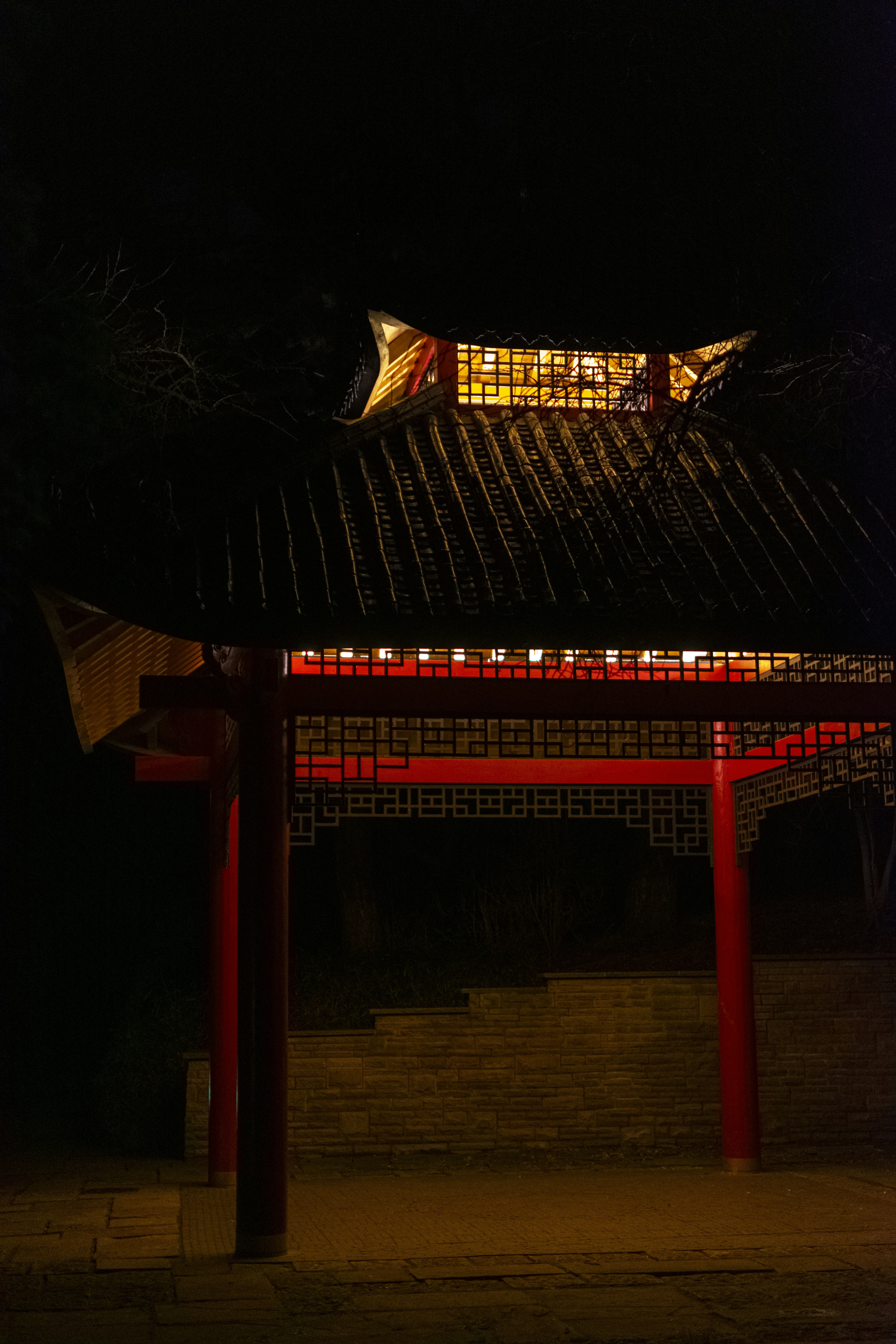 A building lit up at night in the dark photo – Free City Image on Unsplash