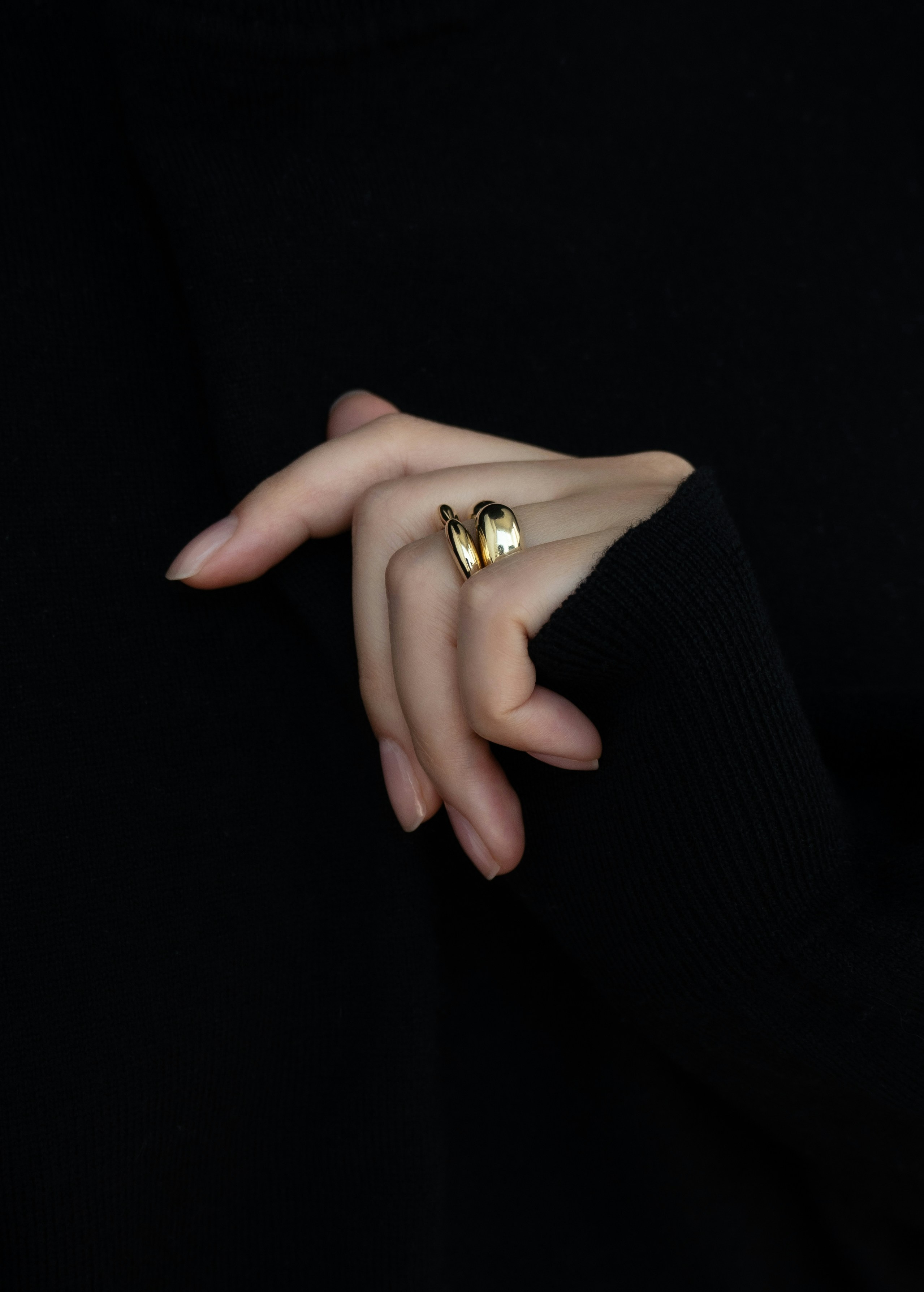 A woman's hand with a ring on it