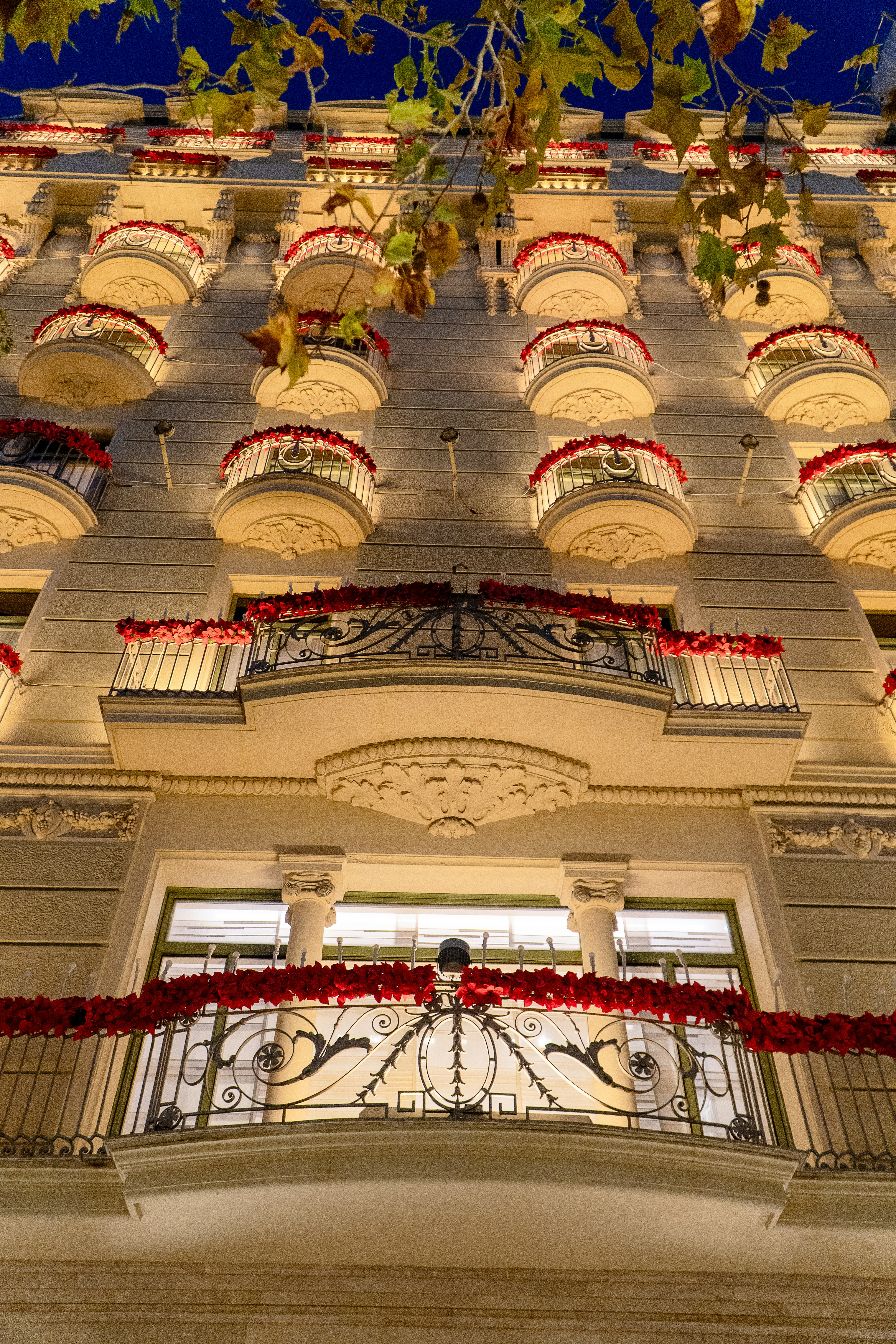 A very tall building with a clock on it's side
