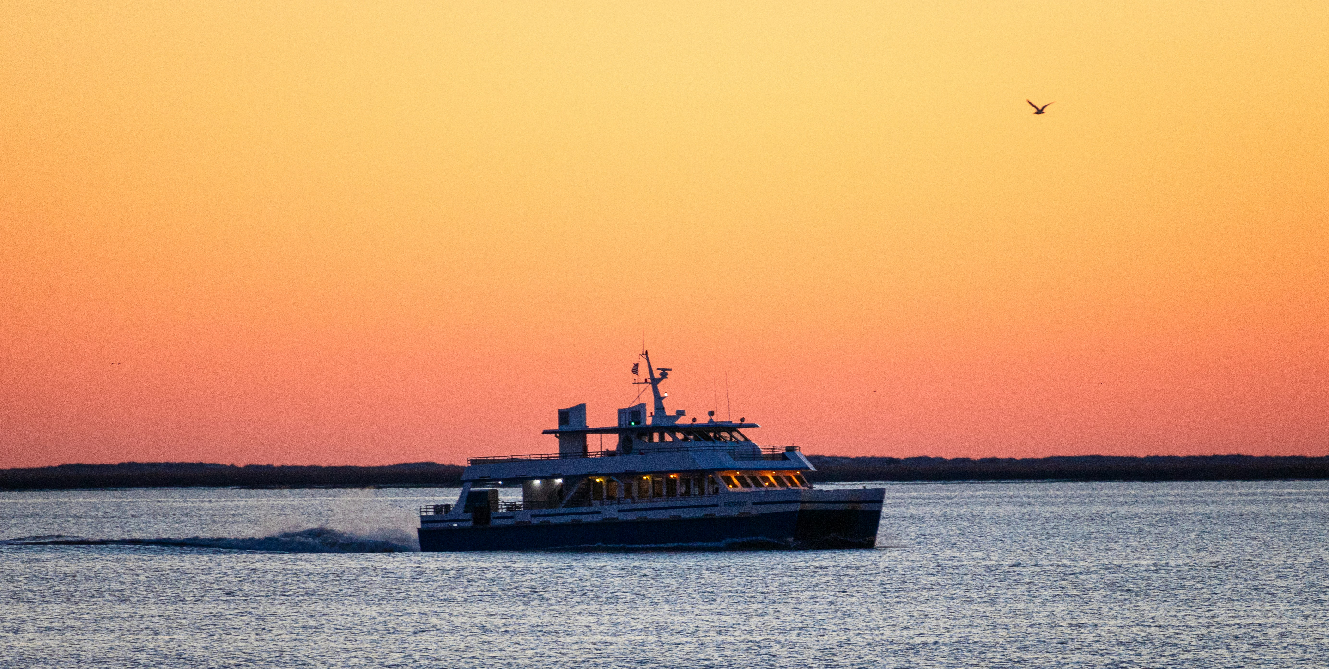 A boat traveling across a large body of water