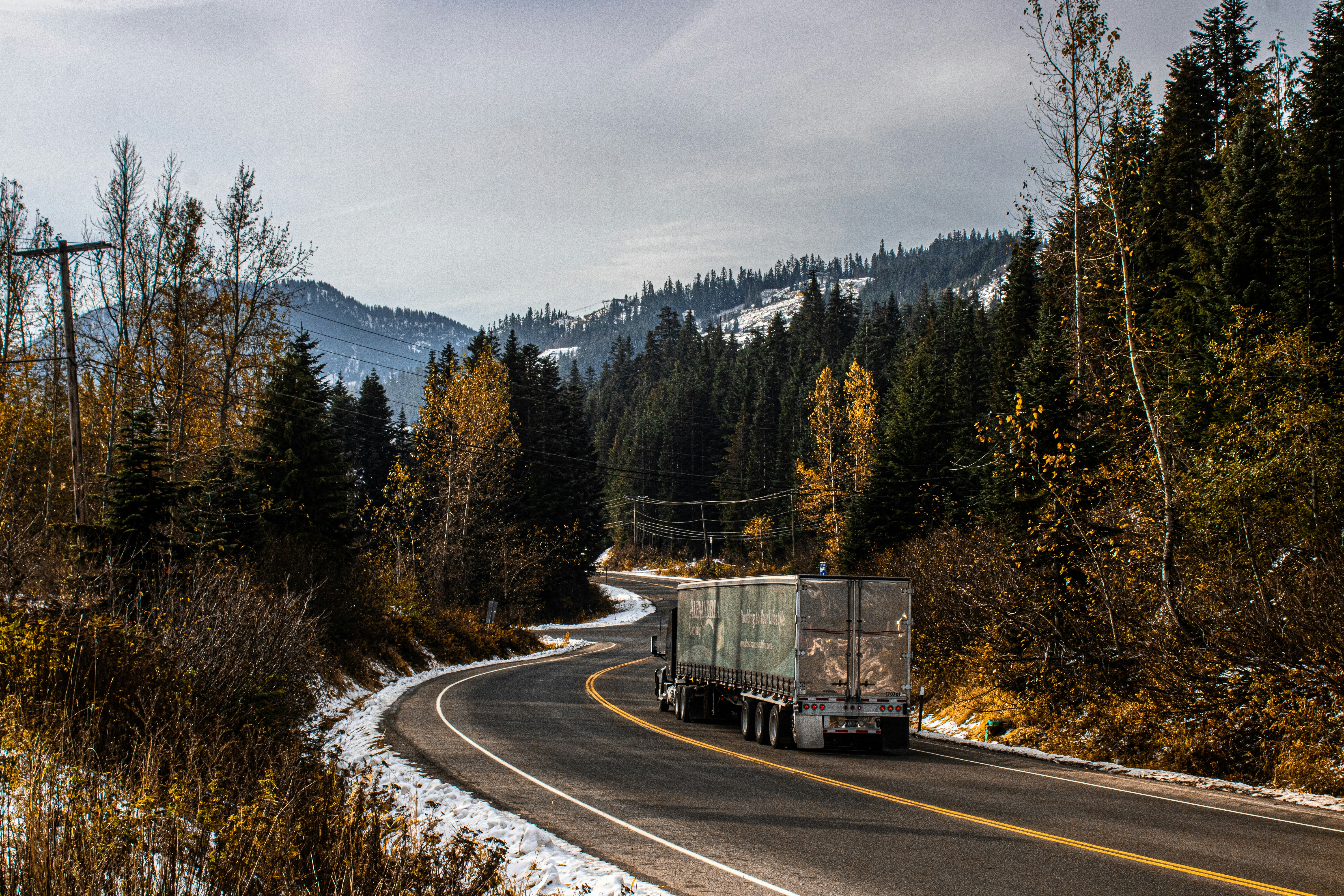 Professional moving truck driving down a scenic Georgia road - movers hiram ga